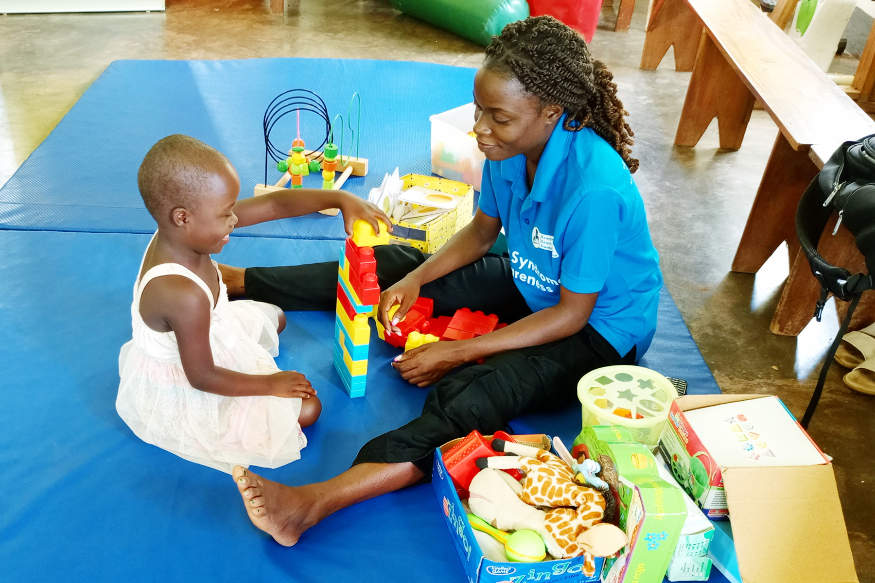 Our speech therapist having a session with one of our members at Masindi Hospital.